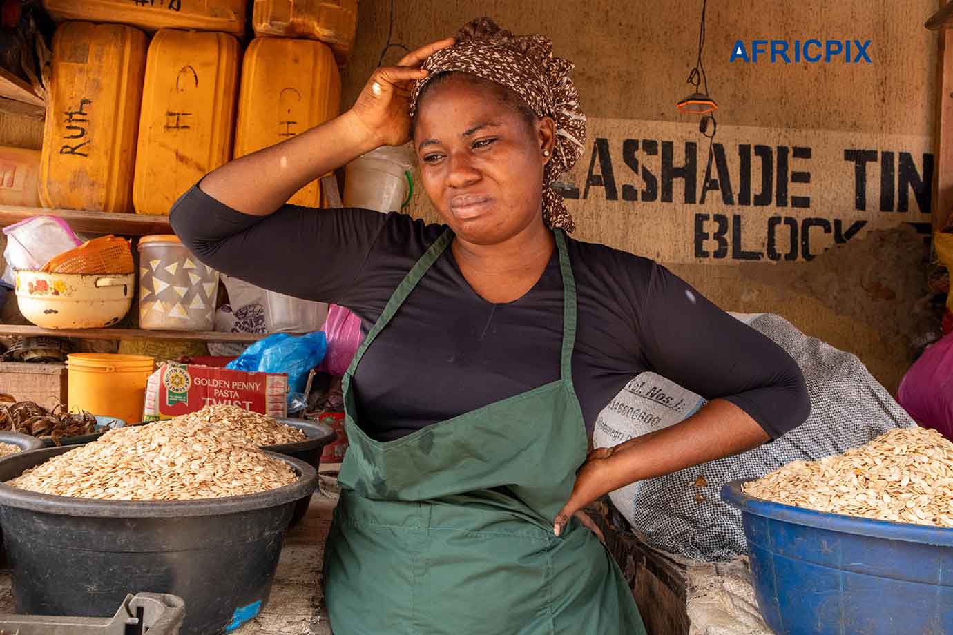 Concerned African Woman Reflecting on Challenges Outside Local Shop